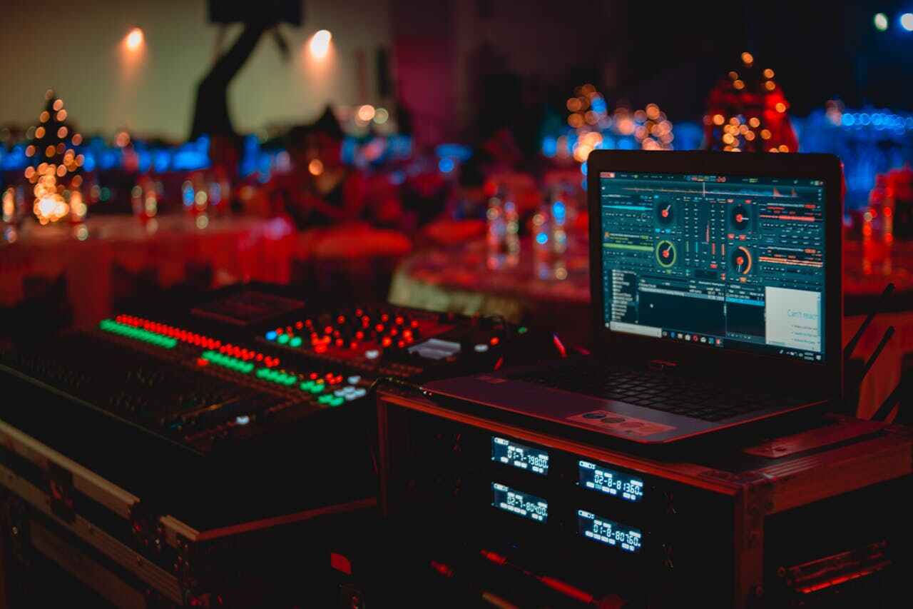 AI in Cybersecurity - Black Laptop Beside Audio Mixer Set